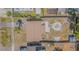 An aerial view shows the home, backyard, driveway, and surrounding neighborhood at 6702 49Th N Ave, St Petersburg, FL 33709