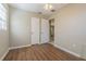 This bedroom boasts updated flooring, ceiling fan, neutral paint, and ample closet space at 6702 49Th N Ave, St Petersburg, FL 33709