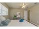 Comfortable bedroom featuring wood floors, soft lighting, and soothing decor at 6702 49Th N Ave, St Petersburg, FL 33709