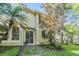 The backyard has beautiful tropical landscaping and a sliding glass door leading inside at 6736 Breezy Palm Dr, Riverview, FL 33578