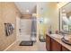 Inviting bathroom with tub/shower combo, tile surround, and updated vanity with double sinks at 6736 Breezy Palm Dr, Riverview, FL 33578