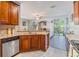Kitchen view showing granite countertops, stainless appliances, and open access to the living room at 6736 Breezy Palm Dr, Riverview, FL 33578