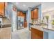 Open kitchen with granite countertops, stainless steel appliances, and ample cabinet space at 6736 Breezy Palm Dr, Riverview, FL 33578