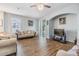Bright living room with hardwood floors and sliding glass doors at 6736 Breezy Palm Dr, Riverview, FL 33578