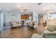 Open floor plan view of the kitchen, living room, and dining room with hardwood floors at 6736 Breezy Palm Dr, Riverview, FL 33578