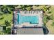 Aerial view of community pool with lounge chairs and tables at 6736 Breezy Palm Dr, Riverview, FL 33578