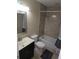 Bathroom features a shower/tub combo, toilet, sink, and a marble tile wall at 7168 E Bank Dr # 7168, Tampa, FL 33617