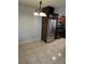 Bright kitchen featuring stainless steel appliances, dark cabinetry and tile flooring at 7168 E Bank Dr # 7168, Tampa, FL 33617