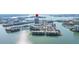 Waterfront condo and marina overlooking a bay with bridges and nearby businesses at 7300 Sun Island S Dr # 605, South Pasadena, FL 33707