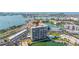 Aerial view showcasing the building's location, pool, marina, and waterfront setting at 7300 Sun Island S Dr # 605, South Pasadena, FL 33707