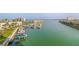 Scenic aerial view of the property with marina, waterways, and surrounding buildings on a sunny day at 7300 Sun Island S Dr # 605, South Pasadena, FL 33707