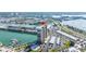 Waterfront condo with boat docks and community pool overlooking a bay with bridges and cityscape at 7300 Sun Island S Dr # 605, South Pasadena, FL 33707