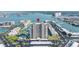 Aerial view of condo complex and marina with waterfront views and surrounding landscape at 7300 Sun Island S Dr # 605, South Pasadena, FL 33707