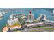 Waterfront condo with community pool, tennis courts, and boat docks overlooking a bay with bridges at 7300 Sun Island S Dr # 605, South Pasadena, FL 33707