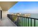 Balcony view overlooking the water and city, framed by black metal railings at 7300 Sun Island S Dr # 605, South Pasadena, FL 33707