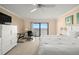 Bedroom with sliding glass doors with a view and a workspace setup at 7300 Sun Island S Dr # 605, South Pasadena, FL 33707
