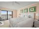 Comfortable bedroom with sliding doors to balcony and tranquil views of the water at 7300 Sun Island S Dr # 605, South Pasadena, FL 33707