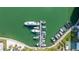 Overhead view of boats docked on a community waterfront near tennis courts at 7300 Sun Island S Dr # 605, South Pasadena, FL 33707