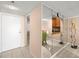 Foyer with mirror feature wall and access to the kitchen and other living spaces at 7300 Sun Island S Dr # 605, South Pasadena, FL 33707