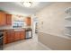 Bright kitchen area with stainless steel sink and view to the living room at 7300 Sun Island S Dr # 605, South Pasadena, FL 33707