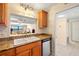 Kitchen area showcasing double sinks, granite countertops, and stainless steel appliances at 7300 Sun Island S Dr # 605, South Pasadena, FL 33707