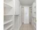 Spacious walk-in closet with custom shelving and storage solutions at 7300 Sun Island S Dr # 605, South Pasadena, FL 33707