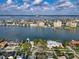 Beautiful waterfront homes along the coast with city and ocean views from above the tree line at 761 Bay Esplanade, Clearwater Beach, FL 33767