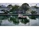 Picturesque waterfront home with private dock access and serene water views from the backyard at 761 Bay Esplanade, Clearwater Beach, FL 33767