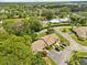 An aerial view of a home featuring well-maintained landscaping and a private driveway at 7633 Piping Rock Ct # 7633, New Port Richey, FL 34654