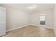 Bedroom features vinyl wood floors, closet and ensuite access at 7633 Piping Rock Ct # 7633, New Port Richey, FL 34654