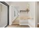 Entryway features storage shelving on the wall and wood-look flooring at 7633 Piping Rock Ct # 7633, New Port Richey, FL 34654