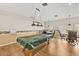 Bright game room features a pool table and multiple tables for cards or board games at 7633 Piping Rock Ct # 7633, New Port Richey, FL 34654
