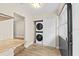 Convenient interior laundry area featuring a stackable washer and dryer at 7633 Piping Rock Ct # 7633, New Port Richey, FL 34654