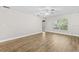 Spacious room with vinyl wood floors and large windows to let the sun shine in at 7633 Piping Rock Ct # 7633, New Port Richey, FL 34654