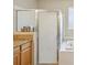 Bathroom featuring a tiled bathtub and a glass-enclosed shower at 8124 Brinegar Cir, Tampa, FL 33647