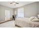 Bedroom with carpet, white linens and a grey accent wall at 8124 Brinegar Cir, Tampa, FL 33647