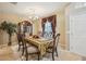 Elegant dining room showcasing traditional furniture, a chandelier, and ample natural light at 8124 Brinegar Cir, Tampa, FL 33647