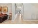 Bright hallway featuring recessed lighting, display niches, and tiled flooring at 8124 Brinegar Cir, Tampa, FL 33647
