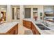 A kitchen featuring an island and light countertops with tile floors at 8124 Brinegar Cir, Tampa, FL 33647