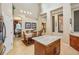 Kitchen featuring an island and light countertops with an adjacent dining area at 8124 Brinegar Cir, Tampa, FL 33647