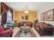 Elegant living room featuring an ornate chandelier, textured walls, and luxurious furnishings at 8124 Brinegar Cir, Tampa, FL 33647