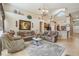 A living room with high ceilings, neutral colors, tile floors, and comfortable seating at 8124 Brinegar Cir, Tampa, FL 33647