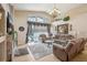 Comfortable living room featuring tile floors, a stone fireplace, and large windows at 8124 Brinegar Cir, Tampa, FL 33647