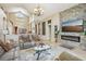 Living room features a stone fireplace, tile flooring, and comfortable seating at 8124 Brinegar Cir, Tampa, FL 33647