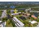 Aerial view of condominium complex featuring lakes, mangroves, and serene views of nature at 8174 Terrace Garden N Dr # 204, St Petersburg, FL 33709