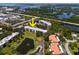 Aerial view of the condo complex surrounded by beautiful ponds and waterways, highlighting its scenic location at 8174 Terrace Garden N Dr # 204, St Petersburg, FL 33709