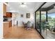 Open dining area with wood floors, adjacent to kitchen and overlooking lanai at 8174 Terrace Garden N Dr # 204, St Petersburg, FL 33709