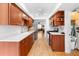 Bright kitchen featuring laminate countertops, stainless appliances, and adjacent dining area at 8174 Terrace Garden N Dr # 204, St Petersburg, FL 33709