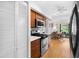 Kitchen area with stainless steel appliances, laminate countertops, and an eat-in kitchen area at 8174 Terrace Garden N Dr # 204, St Petersburg, FL 33709