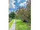 Beautiful landscaping with lush greenery and a winding walking path at 8174 Terrace Garden N Dr # 204, St Petersburg, FL 33709